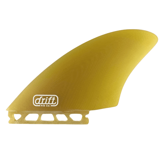 A golden colored surfboard keel fin, radiating energy and excitement. The fin boasts a golden color color, adding a vibrant touch to the surfboard. Positioned near the tail, the keel fin provides stability and enhances maneuverability, allowing for an exhilarating and dynamic surfing experience.
